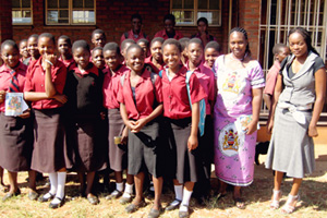 Students participate in the Take Charge Program along with their teacher, Annie Jere (in purple dress, second right) and Bible Society of Malawi Bible Youth Advocates Project Officer, Miss Silvia Matola (far right). Photo by Rhoda Gathoga.