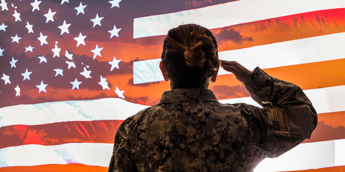 Female American Soldier Salutes US Flag