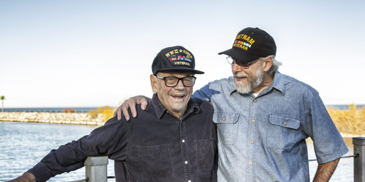 Two Generations Of Playful USA Military Veterans Telling Jokes