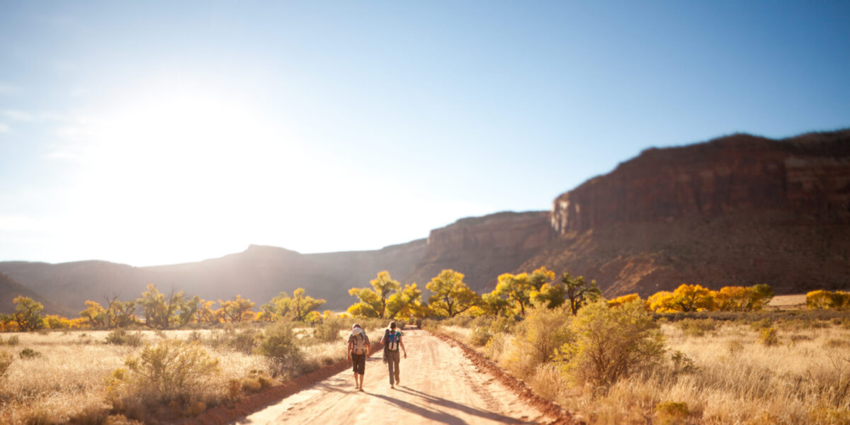 Husband and wife going for a hike together in Utah