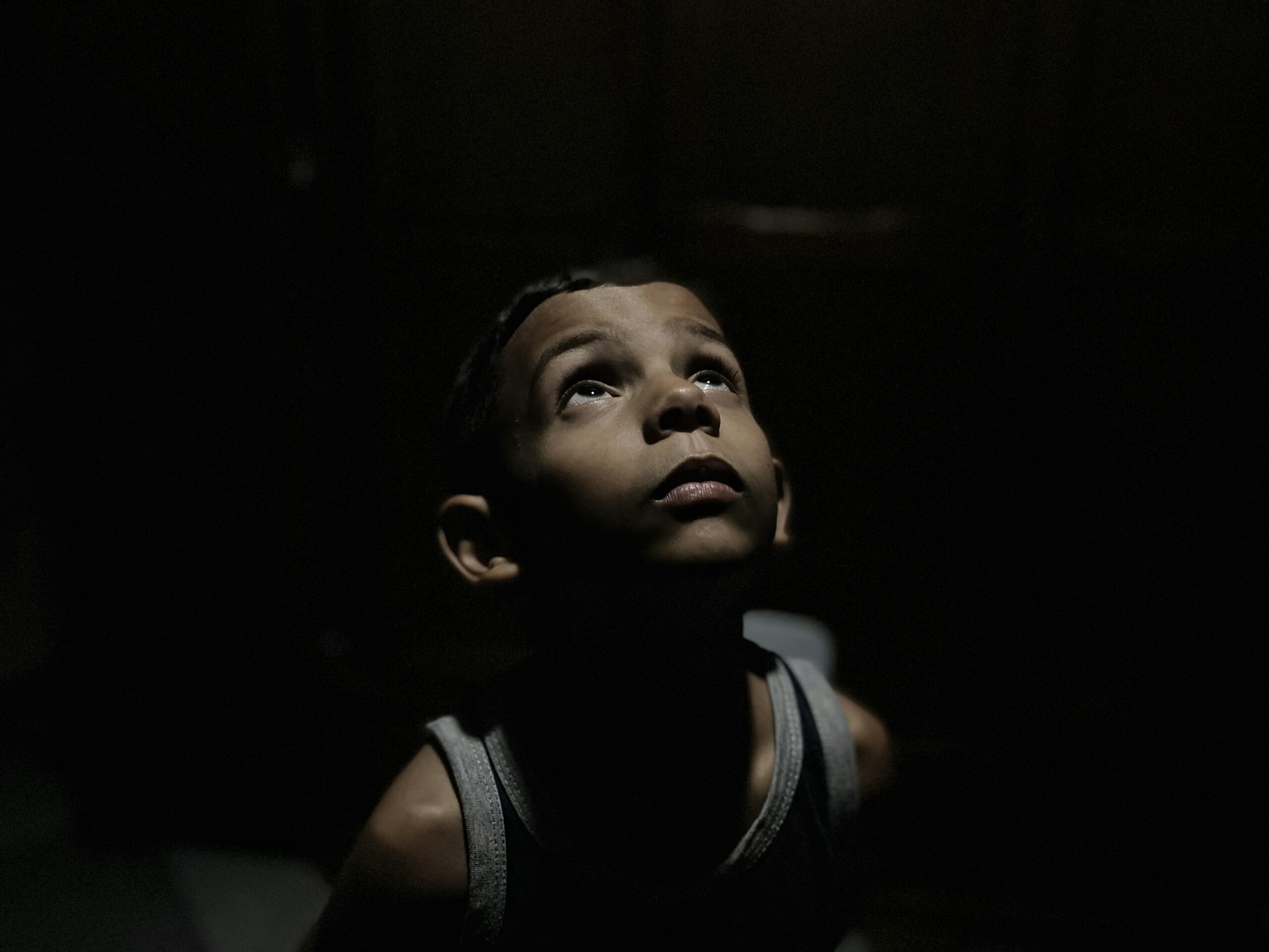 Young boy holding a Bible